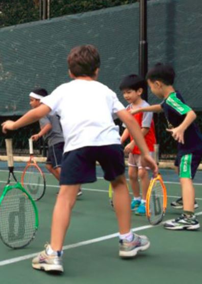 Kids playing tennis